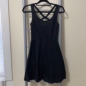 Black dress with white poll dots and X cross back